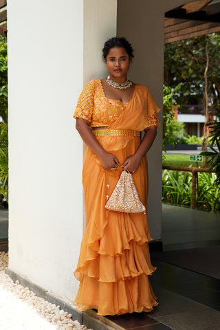 Tangerine ruffle sari teamed with embroidered blouse and belt